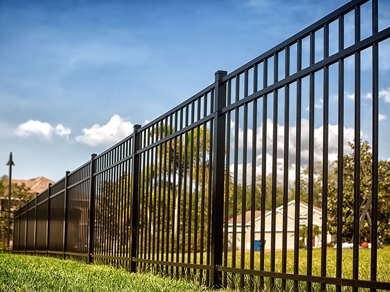 black-fence-houston-tx - Mustang Fencing and Gates A modern black fence installation in Houston, TX showcasing sleek design and durability by Mustang Fencing and Gates.