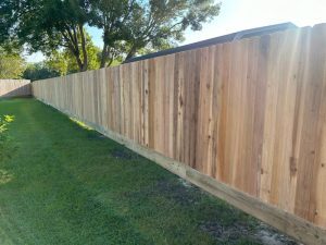 A 213 Cedar Fence being built for Elaine and Steve Athanasiou in Santa Fe, TX by Mustang Fencing and Gates.