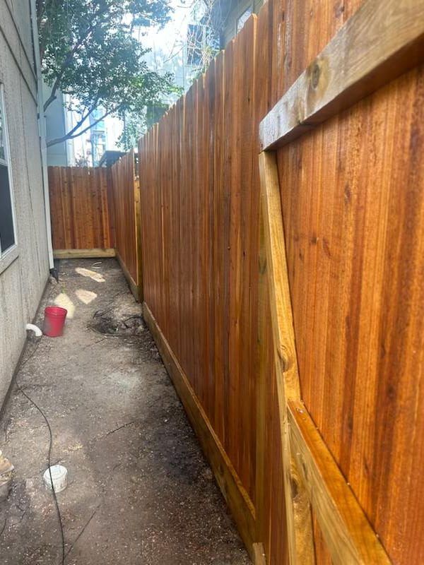Fran_Apstein's_Cedar_Fence_Project_in_Crosby,_Texas - Mustang Fencing and Gates A cedar fence project completed by Fran Apsteins in Crosby, Texas, showcasing expert craftsmanship and quality materials.