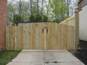 A double-doored arched 4x6 drive-in gate installed in Houston by Mustang Fencing and Gates.