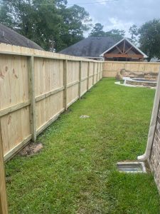 A photo of a Mustang Fencing service in Crosby, showcasing a sturdy and well-built fence surrounding a property.