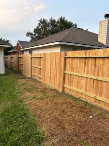A satisfying cedar fence installation completed for Michelle Cantu in Houston, TX by Mustang Fencing and Gates.