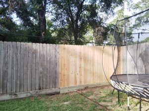 Custom cedar fence with reinforcement installed at Karla Woodroof's home in Atascocita, TX, showcasing expert craftsmanship and durability.