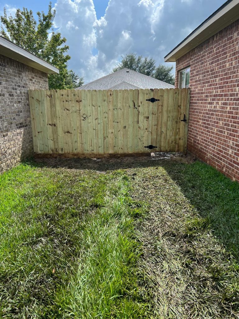 Crafting an Elegant Cedar Fence Top and Trim for Victor Harris in Spring, Texas, - Mustang Fencing and Gates A close-up image of a craftsman working on an elegant cedar fence top and trim for Victor Harris in Spring, Texas.