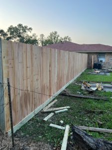 A stunning cedar fence and gate installed by Mustang Fencing and Gates for Wilda Garret in Porter, Texas.