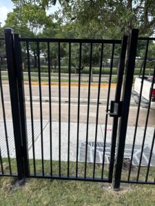 "Black metal gate in Houston, TX installed by Mustang Fencing and Gates."