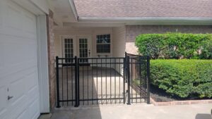 "Metal gate fence in Houston, TX installed by Mustang Fencing and Gates."