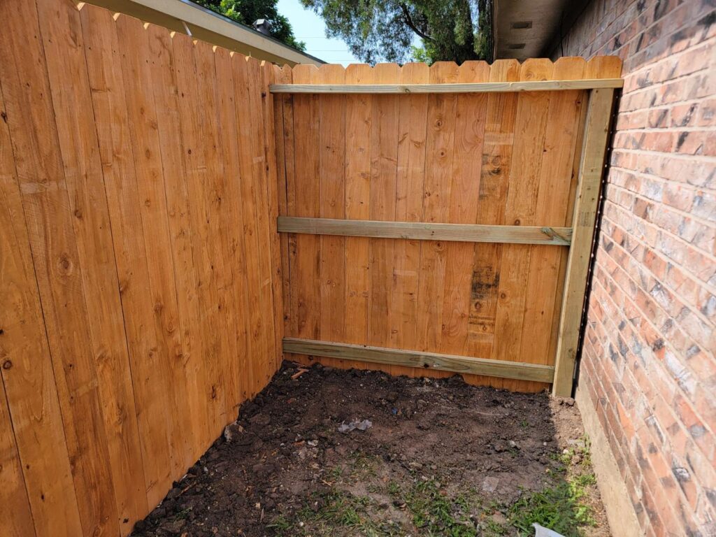 houston tx wood fence backyard installation - Mustang Fencing and Gates "Wooden fence installation in a backyard in Houston, TX by Mustang Fencing and Gates."