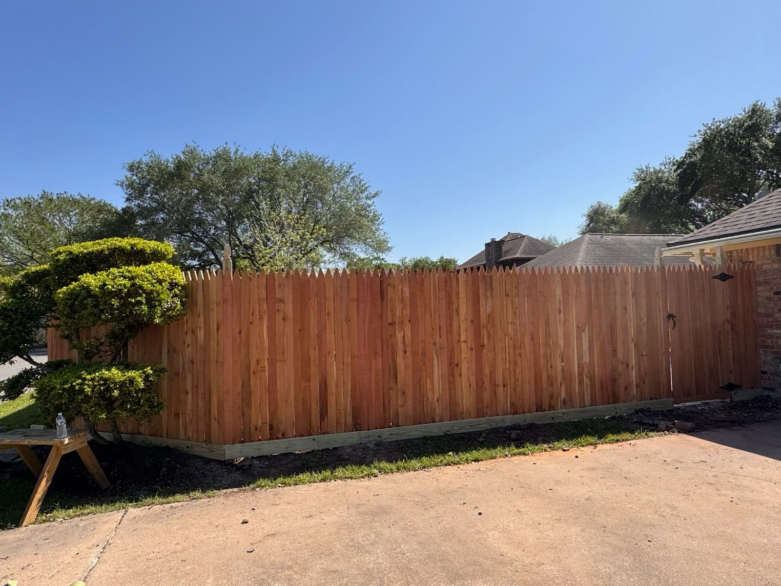 Wooden privacy fence in a Houston backyard by Mustang Fencing and Gates