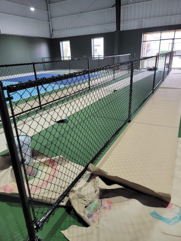 indoor chain link fence houston tx - Mustang Fencing and Gates "Indoor chain-link fence installation in Houston, TX by Mustang Fencing and Gates."