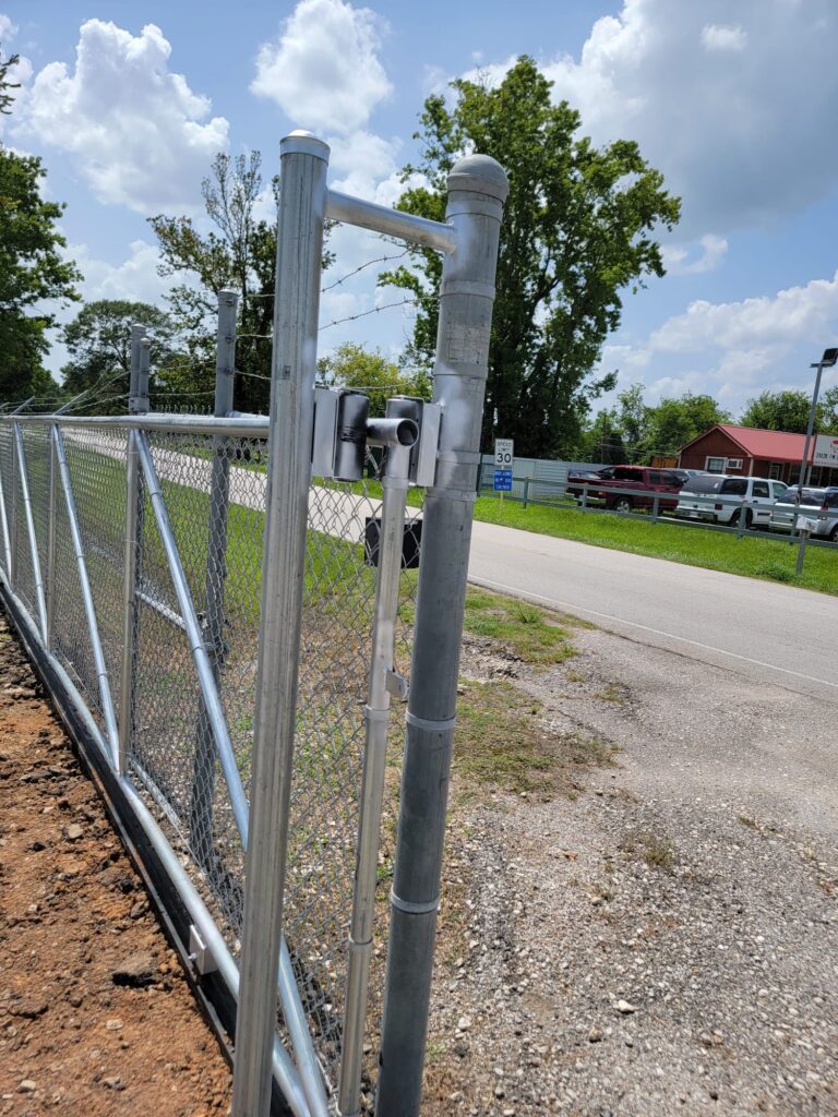 "Metal chain link fence gate in Houston, Texas, provided by Mustang Fencing and Gates."