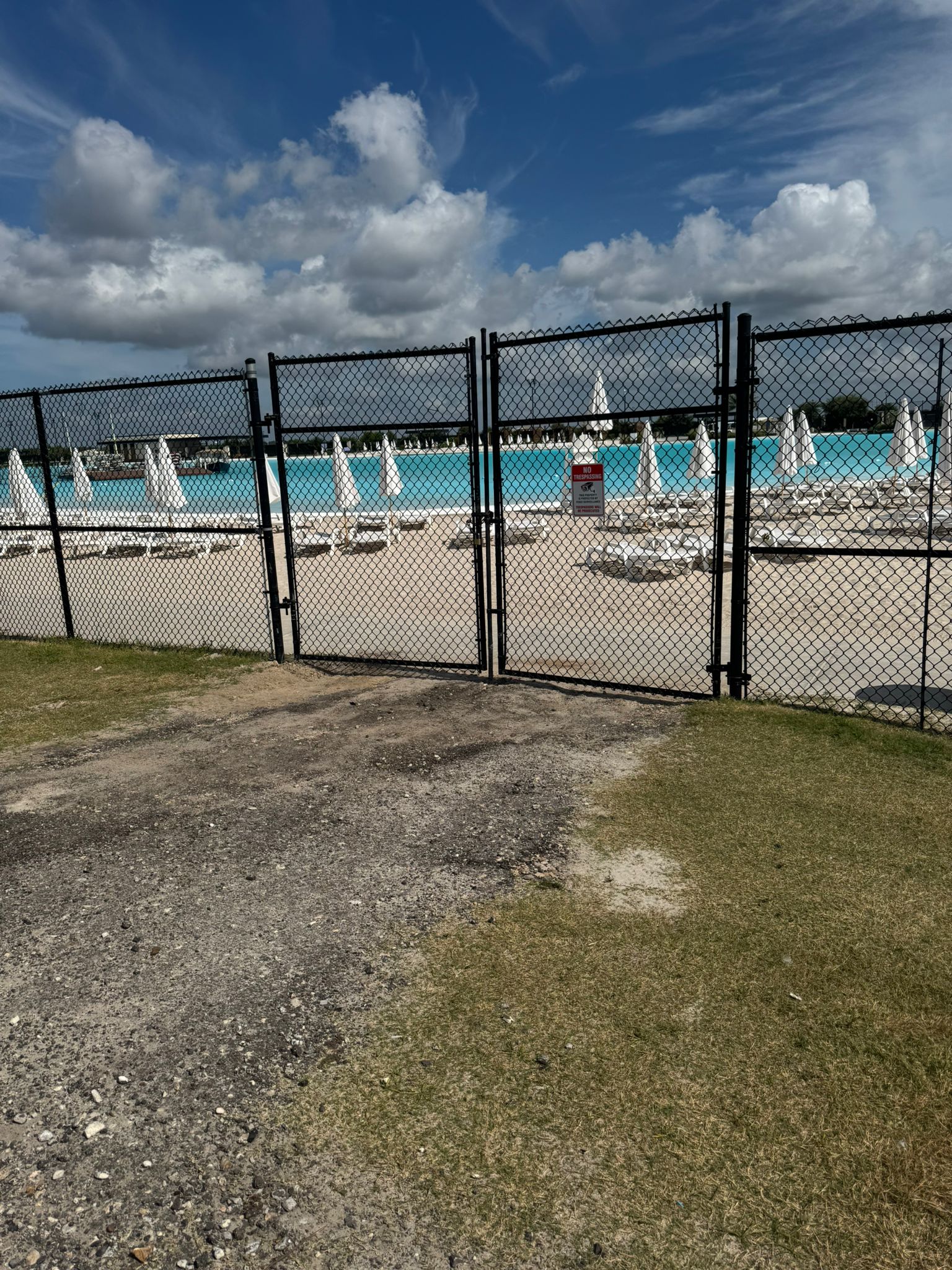 Code-compliant metal pool fence installed at a Houston-area pool