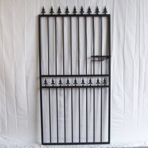 "Wrought iron gate in Houston, TX, showcasing intricate design and craftsmanship by Mustang Fencing and Gates."