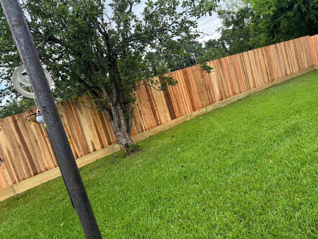 houston-cedar-wood-fence-installation-residential-yard - Mustang Fencing and Gates