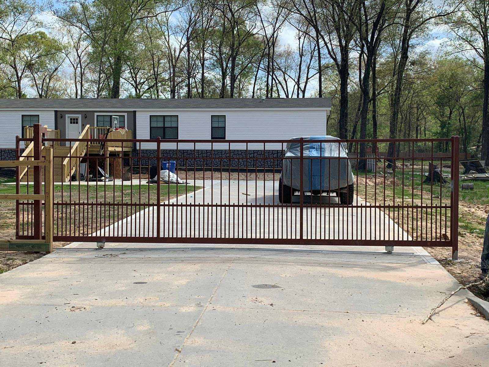 Residential metal fence installation houston driveway gate