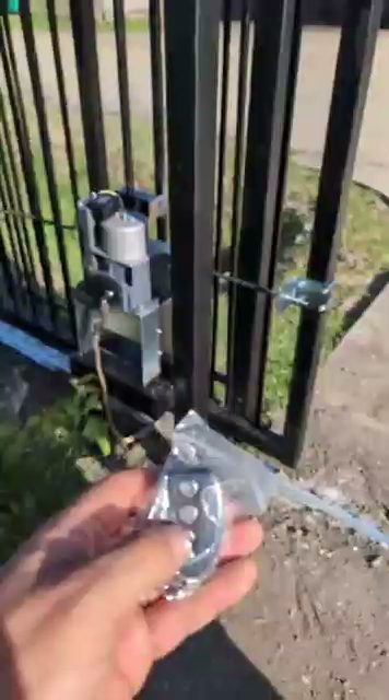 A wireless key-fob remote activates an automatic gate operator, delivering keyless access at the touch of a button.