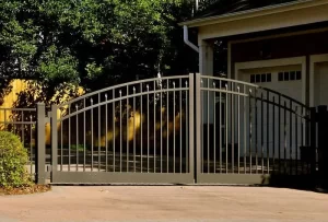 A custom aluminum gate with intricate design and modern style, perfect for enhancing the curb appeal of any property.